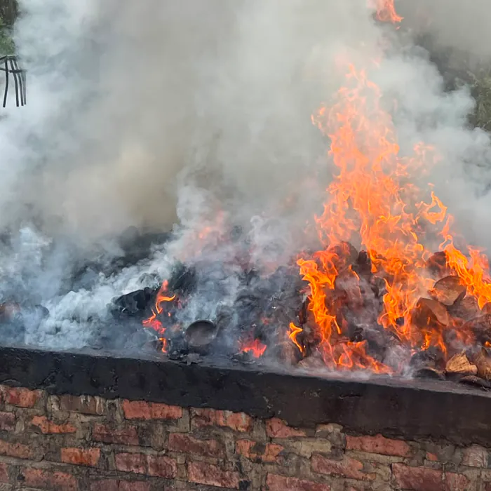 Smoke rising from the traditional brick kiln