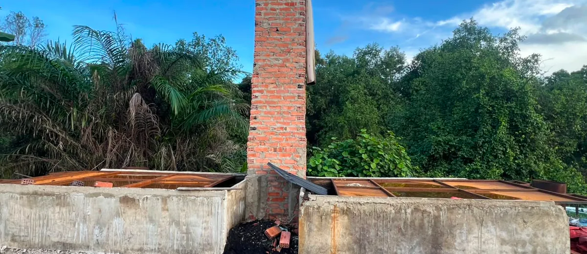 Company-owned brick kiln with chimney at the production site