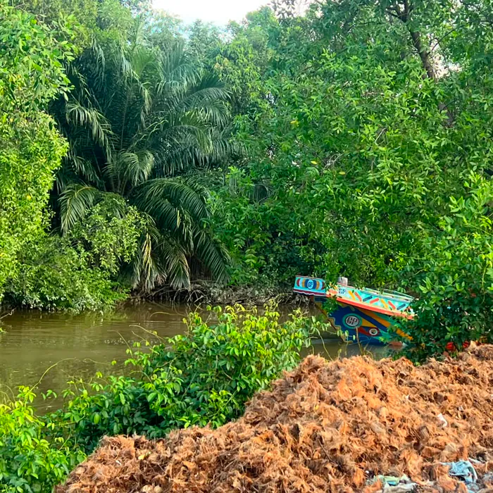 Cargo boat on the river next to the production site